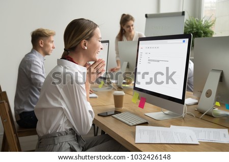 Happy businesswoman looking at computer screen reading email excited by good news online, smiling woman employee motivated by great offer or new opportunity in electronic letter, got a job promotion Royalty-Free Stock Photo #1032426148