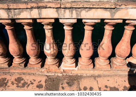 Small orange pillars on a balcony in Barcelona