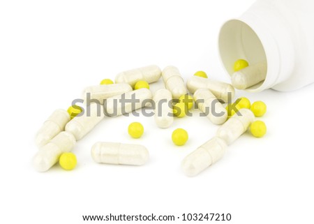 medicine capsules scattered on a white background