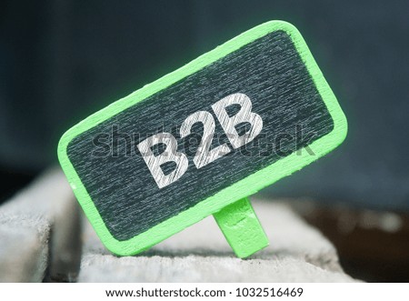wooden clip written B2B over blurred background