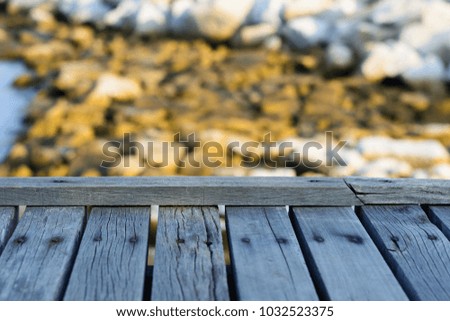 wooden board empty table in front of blurred background