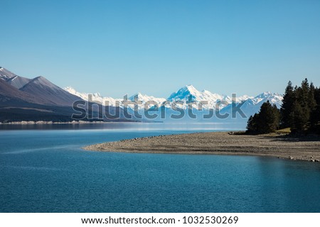 Snow capped Mount Cook set against the blue waters of Lake Taupo, New Zealand Royalty-Free Stock Photo #1032530269