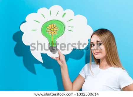 Eco Energy with young woman holding a speech bubble