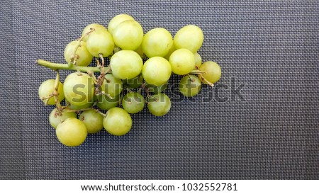green grape on the texture background