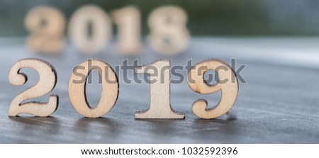 Year 2019 numbers on wooden table top
