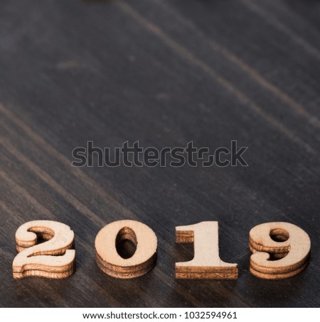 Year 2019 digits on dark wooden table top