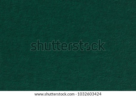 Green textured paper background. 