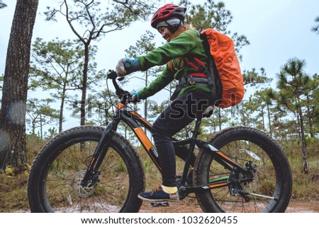  Asian women Travel photograph Nature. Travel relax ride a bike Wilderness in the wild. Thailand 