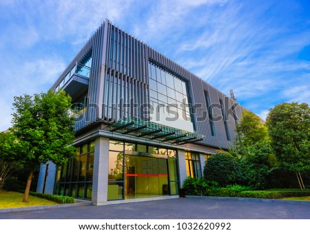 The office building is at dusk. Royalty-Free Stock Photo #1032620992