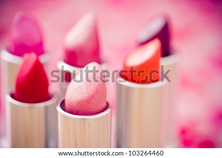 collection of different lipsticks colors Royalty-Free Stock Photo #103264460