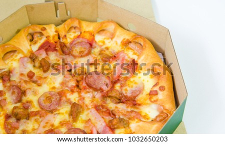 The delivery pizza pepperoni meat deluxe closeup shot isolated.