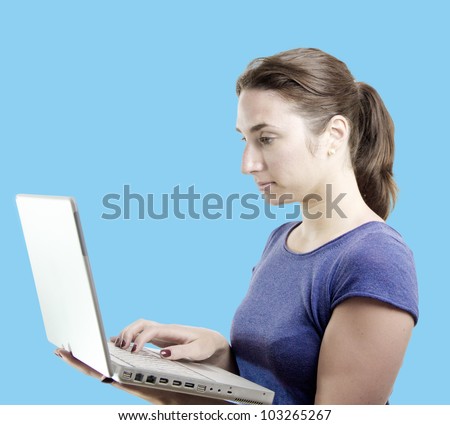 Young business woman holding a laptop with a confident look over blue editable monochrome background