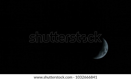 A half moon down in the right corner. Crescent phase.