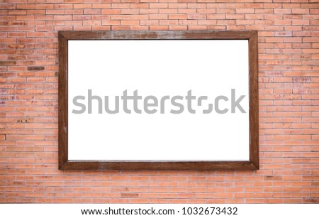 Blank wooden board on red brick wall