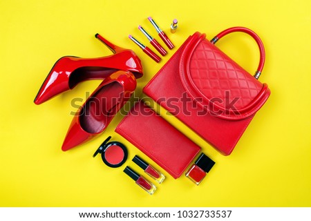 Overhead view of essential beauty items, Top view of red leather bag, red shoes and cosmetic