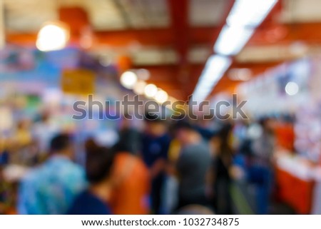 Abstract crowd people walking in trade fair expo in exhibition hall