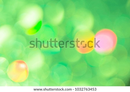 Blurred light green background. Blurred green background with colorful highlights. Bokeh. Out-of-focus areas.