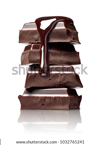 close up of chocolate pieces stack and chocolate syrup on white background Royalty-Free Stock Photo #1032765241