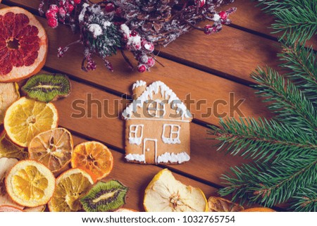 Gingerbread and dried fruits on a wooden table. Christmas New Year concept