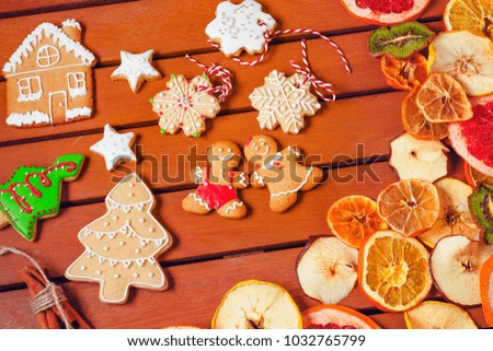 Gingerbread and dried fruits on a wooden table. Christmas New Year concept