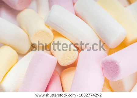 Beautiful colorful and delicious candy sweets and jelly marshmallows. Different shapes and composition lollipops marmalade isolated on abstract blurred white background. Closeup. Soft selective focus