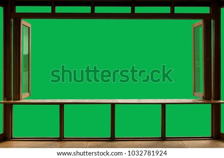 Beautiful cafe style minimal with wood tables and terrace against the outdoor with Green screen blank view isolated in cafe and clipping path.