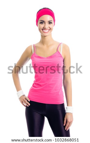 Portrait of young happy smiling woman in red sportswear, isolated against white background