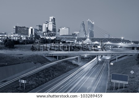 Kansas City. Toned image of the Kansas City skyline and busy highway system leading to the city.