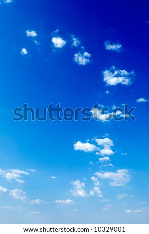 white clouds on a background of the blue sky