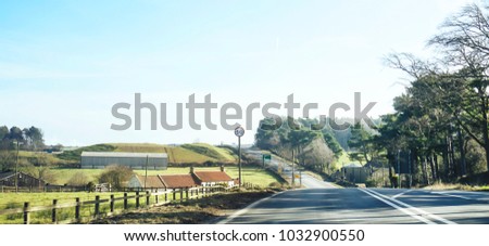 Panoramic of English countryside on sunny day in spring season, The road with 50 traffic limit sign at countryside in the England in retro tone, 