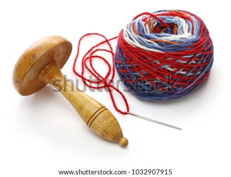 darning mushroom, yarn ball and needle Royalty-Free Stock Photo #1032907915