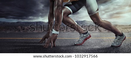 Sports background. Runner feet running on road closeup on shoe. Start line Royalty-Free Stock Photo #1032917566