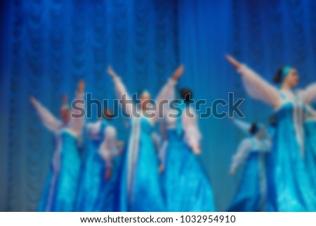 Folk dances of children and teens theme abstract blur background with bokeh effect.
