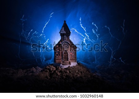 Scary view of church and spooky cloudy sky with fog, Horror Halloween concept. Toned