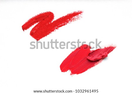 Group of smears lipsticks close-up isolated on white background. Make-up, beauty.