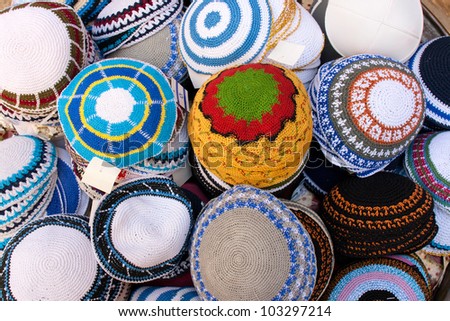 A Kippah or Kipa or Yarmulke - is a hemispherical or platter-shaped cap, usually made of cloth, often worn by Religious Jewish men Royalty-Free Stock Photo #103297214