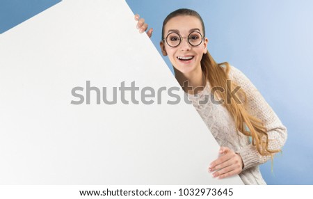 Attractive young woman with blank banner