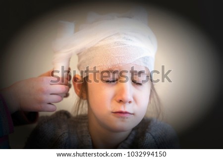 Pediatrician doctor healing the head of a child. vignetting