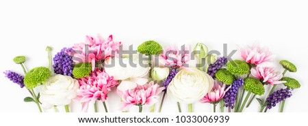 Flowers composition made of ranunculus, chrysanthemum and other flowers on white background. Flat lay, top view.