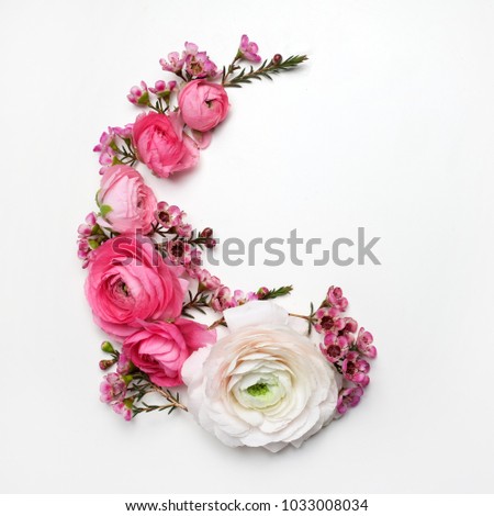 Floral round frame with ranunculus flowers, flat lay, top view with copy space