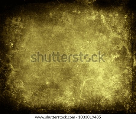 Grunge gold scratched texture background with black frame and space for your text or picture