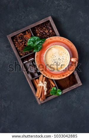 Coffee cup and wooden box  with  winter spices. Top view