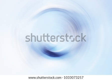 Beautiful blue abstract minimalism artwork background. Interesting light effect of vivid tones in clear water of a pool in hot summer day. Radial motion post-processing of an original photograph