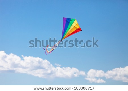 colorful kite flying in the wind Royalty-Free Stock Photo #103308917