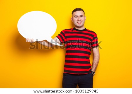 Handsome man in bright T-shirt with speech bubble