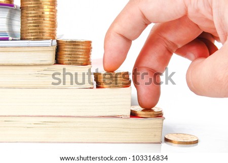 Books and coin on white background