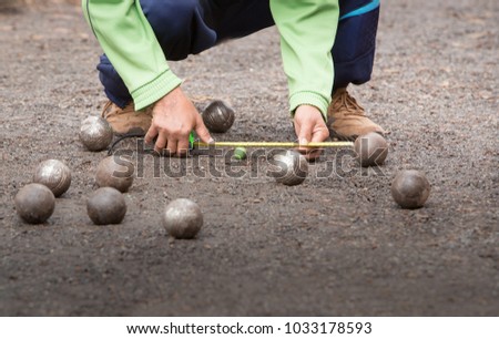 Petanque  game,measuring the distance