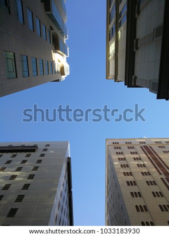building architacture and blue clouds view from below