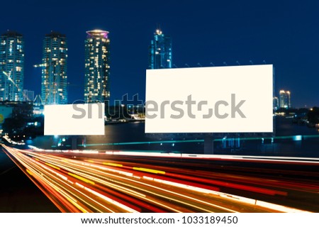 Blank template  for outdoor advertising or blank billboard on the highway during the twilight. With clipping path on screen - can be used for trade shows, and advertising or promotional poster.