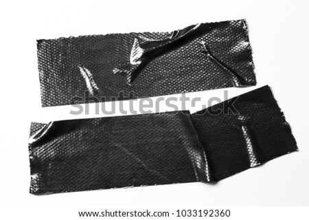 Set of black tapes on white background. Torn horizontal and different size black sticky tape, adhesive pieces. Royalty-Free Stock Photo #1033192360
